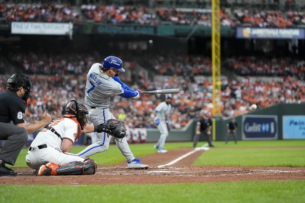 Kansas City Royals' Bobby Witt Jr. (7) hits in an RBI single during the sixth inning of Game 1 of an AL Wild Card Series baseball game against the Baltimore Orioles, Tuesday, Oct. 1, 2024, in Baltimore. (AP Photo/Stephanie Scarbrough)