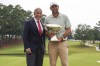 FILE - PGA TOUR Commissioner Jay Monahan poses with Scottie Scheffler with the FedExCup Trophy after Scheffler won the final round of the Tour Championship golf tournament Sept. 1, 2024, in Atlanta. (AP Photo/Jason Allen, File)