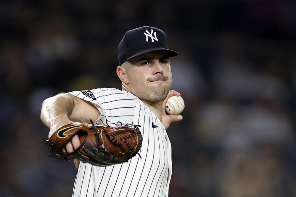 New York Yankees starting pitcher Carlos Rodon throws during the first inning of a baseball game against the Pittsburgh Pirates, Friday, Sept. 27, 2024, in New York. (AP Photo/Adam Hunger)
