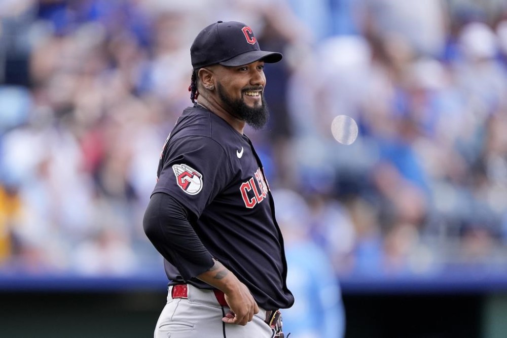 FILE - Cleveland Guardians relief pitcher Emmanuel Clase reacts after a baseball game against the Kansas City Royals, Sept. 2, 2024, in Kansas City, Mo. (AP Photo/Charlie Riedel, File)