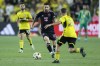 Inter Miami's Lionel Messi dribbles the ball as Columbus Crew's Alexandru Matan defends during the first half of an MLS soccer match Wednesday, Oct. 2, 2024, in Columbus, Ohio. (AP Photo/Jay LaPrete)