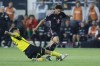 Inter Miami's David Ruiz, right, tries to kick the ball past Columbus Crew's Marcelo Herrera during the second half of an MLS soccer match, Wednesday, Oct. 2, 2024, in Columbus, Ohio. (AP Photo/Jay LaPrete)