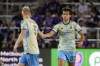 Philadelphia Union's Quinn Sullivan (33) celebrates his goal against Orlando City with teammate Jakob Glesnes (5) during the second half of an MLS soccer match, Wednesday, Oct. 2, 2024, in Orlando, Fla. (AP Photo/John Raoux)