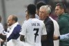 Real Madrid's head coach Carlo Ancelotti, right, talks with Vinicius Junior during the Champions League opening phase soccer match between Lille and Real Madrid at the Stade Pierre Mauroy in Villeneuve-d'Ascq, outside Lille, France, Wednesday, Oct. 2, 2024. (AP Photo/Thibault Camus)