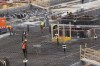 FILE - Workers operate inside the construction site of the Olympic Village at the Porta Romana former railway yard, in Milan, Italy, March 1, 2023. (AP Photo/Luca Bruno, File)