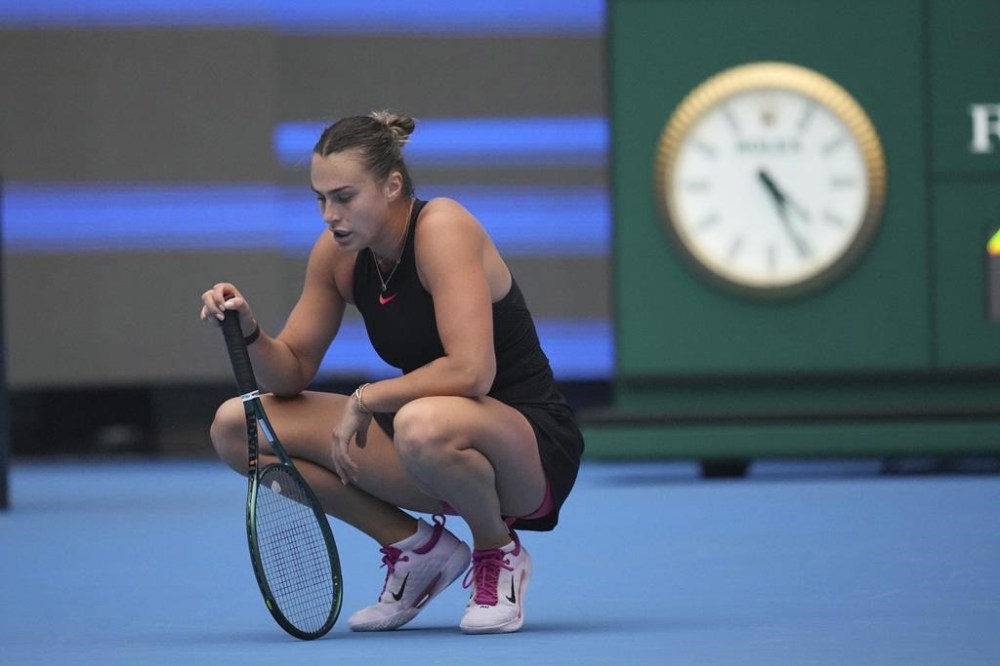 Aryna Sabalenka of Belarus reacts during the women's singles quarterfinals match against Karolina Muchova of the Czech Republic in the China Open tennis tournament, at the National Tennis Center in Beijing, Friday, Oct. 4, 2024. (AP Photo/Achmad Ibrahim)