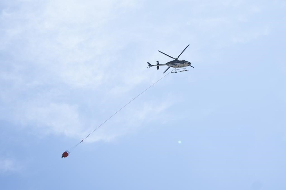 The Nova Scotia government is getting new helicopters to help fight wildfires through a contract worth more than $25 million with aerospace giant Airbus. A water bombing helicopter carries water as emergency responders battle a wildfire burning in Tantallon, N.S., on Wednesday, May 31, 2023. THE CANADIAN PRESS/Darren Calabrese