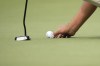 A golfer marks his ball on the putting green at a golf tournament in Jackson, Miss., Thursday, Oct 5, 2023. THE CANADIAN PRESS/AP-Rogelio V. Soli