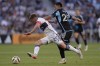 Vancouver Whitecaps midfielder Ryan Gauld, left, and Minnesota United midfielder Alejandro Bran battle for possession during the first half of an MLS soccer match in St. Paul, Minn., Wednesday, July 3, 2024. THE CANADIAN PRESS/AP-Abbie Parr