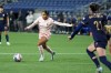 Angel City FC forward Alyssa Thompson moves the ball against Seattle Reign defender Phoebe McClernon (21) during the second half of an NWSL soccer match Friday, Oct. 4, 2024, in Seattle. Angel City won 1-0. (AP Photo/Lindsey Wasson)