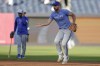 Kansas City Royals shortstop Paul DeJong (15) fields balls during batting practice before Game 1 of the Major League Baseball division series against the New York Yankees, Saturday, Oct. 5, 2024, in New York. (AP Photo/Adam Hunger)