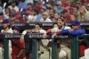 Philadelphia Phillies' Bryce Harper, second right, looks on from the dugout with teammates during the ninth inning of Game 1 of a baseball NL Division Series against the New York Mets, Saturday, Oct. 5, 2024, in Philadelphia. (AP Photo/Chris Szagola)