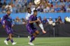 CF Montréal forward Sunusi Ibrahim (14), back, watches his shot go past Charlotte FC defender Adilson Malanda during an MLS soccer match in Charlotte, N.C., Saturday, Oct. 5, 2024. (AP Photo/Nell Redmond)