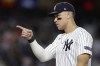 New York Yankees outfielder Aaron Judge motions as he walks off the field after the Yankees defeated the Kansas City Royals in Game 1 of the American League baseball division series, Saturday, Oct. 5, 2024, in New York. (AP Photo/Adam Hunger)