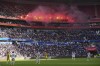 Nantes' fans burn flares during the French League One soccer match between Lyon and FC Nantes at the Groupama stadium in Decines, outside Lyon, France, Sunday, Oct. 6, 2024. (AP Photo/Laurent Cipriani)