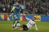 Legia Warsaw Luquinhas, right, fights for the ball with Real Betis' Johnny Cardoso during the Europa League soccer match between Legia Warsaw and Real Betis in Warsaw, Poland, Thursday Oct. 3, 2024. (AP Photo/Czarek Sokolowski)