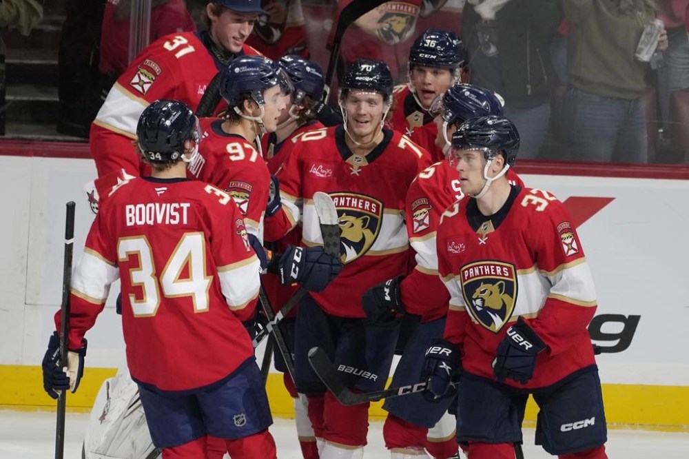Florida Panthers center Jesper Boqvist (70) celebrates his game winning goal during overtime at a preseason NHL hockey game against the Carolina Hurricanes, Saturday, Sept. 28, 2024, in Sunrise, Fla. (AP Photo/Marta Lavandier)