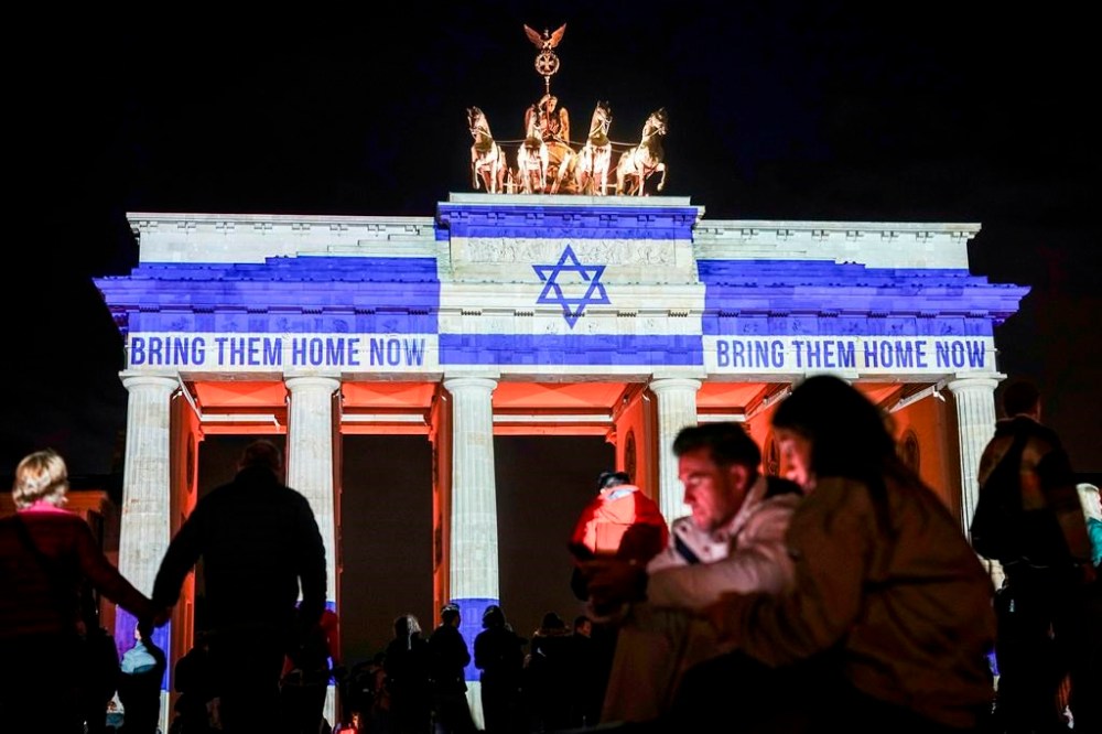 The Brandenburg Gate is illuminated with the flag of Israel in Berlin, Germany, Monday, Oct. 7, 2024, to mark the anniversary of the Hamas attack on Israel on Oct. 7, 2023. (Kay Nietfeld/dpa via AP)
