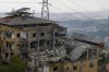 Destroyed buildings are seen after being hit by Israeli airstrikes in the village of Qmatiyeh, southeast Beirut, Lebanon, Monday, Oct. 7, 2024. The foreign affairs minister's office says another plane is set to leave Lebanon today to evacuate Canadians from the country as conflict escalates between Israel and the Lebanon-based militant group Hezbollah. THE CANADIAN PRESS/AP/Bilal Hussein