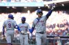 New York Mets' Mark Vientos celebrates after hitting a two-run home run against Philadelphia Phillies pitcher Cristopher Sánchez during the third inning of Game 2 of a baseball NL Division Series, Sunday, Oct. 6, 2024, in Philadelphia. (AP Photo/Chris Szagola)
