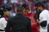 From left, Cleveland Guardians catcher Bo Naylor, home plate umpire Ramon DeJesus and pitching coach Carl Willis talk with pitcher Emmanuel Clase, right, during a mound meeting in the ninth inning during Game 2 of baseball's AL Division Series against the Detroit Tigers, Monday, Oct. 7, 2024, in Cleveland. (AP Photo/Phil Long)