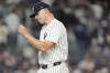New York Yankees pitcher Carlos Rodón reacts as he walks off the field during the fourth inning of Game 2 of the American League baseball playoff series against the Kansas City Royals, Monday, Oct. 7, 2024, in New York. (AP Photo/Frank Franklin II)