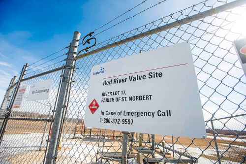 MIKAELA MACKENZIE / FREE PRESS

Imperial Oil pipeline signs just south of St. Adolphe, near the Red River, on Monday, March 18, 2024.  The company has decided to shut down the pipeline and undertake repairs after pipeline inspections identified integrity concerns.

For Katie/Tyler story.