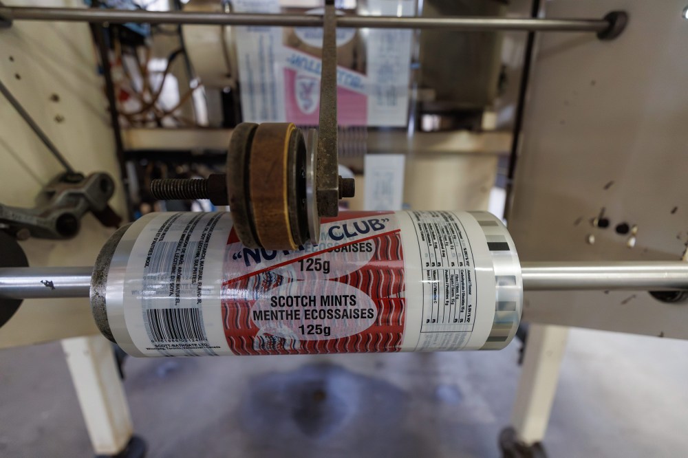 MIKE DEAL / FREE PRESS
A roll of bags that would have been used to hold Scotch Mints is still on a machine.