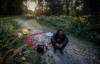 Andrew Desjarlais sits beside a memorial for Tammy Bateman. (John Woods / Free Press)
