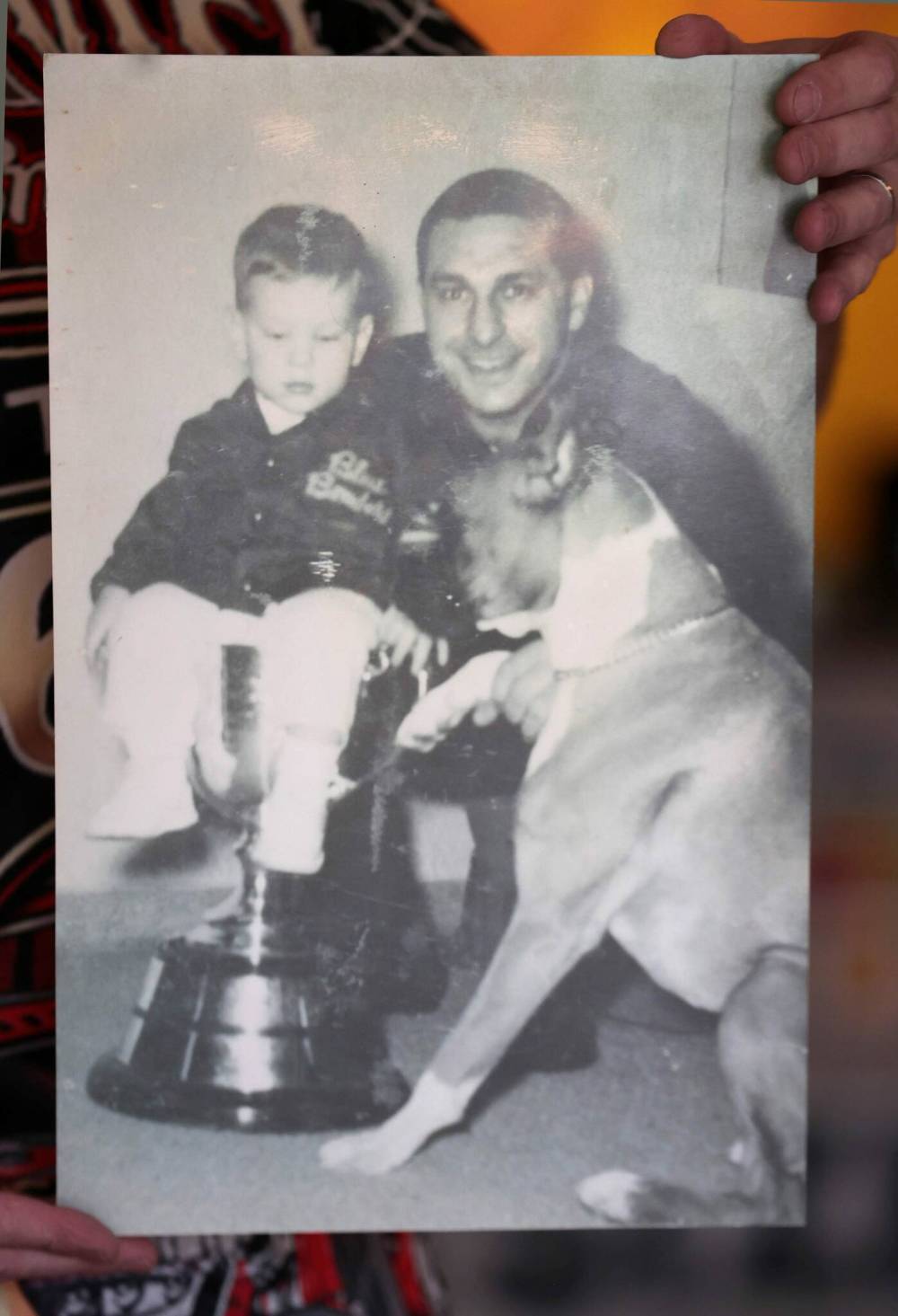 RUTH BONNEVILLE / FREE PRESS
A young Gregg Druxman sits in the Grey Cup in a portrait with his dad George Druxman. The elder Druxman (1929-99) won four CFL championships with the Winnipeg Blue Bombers