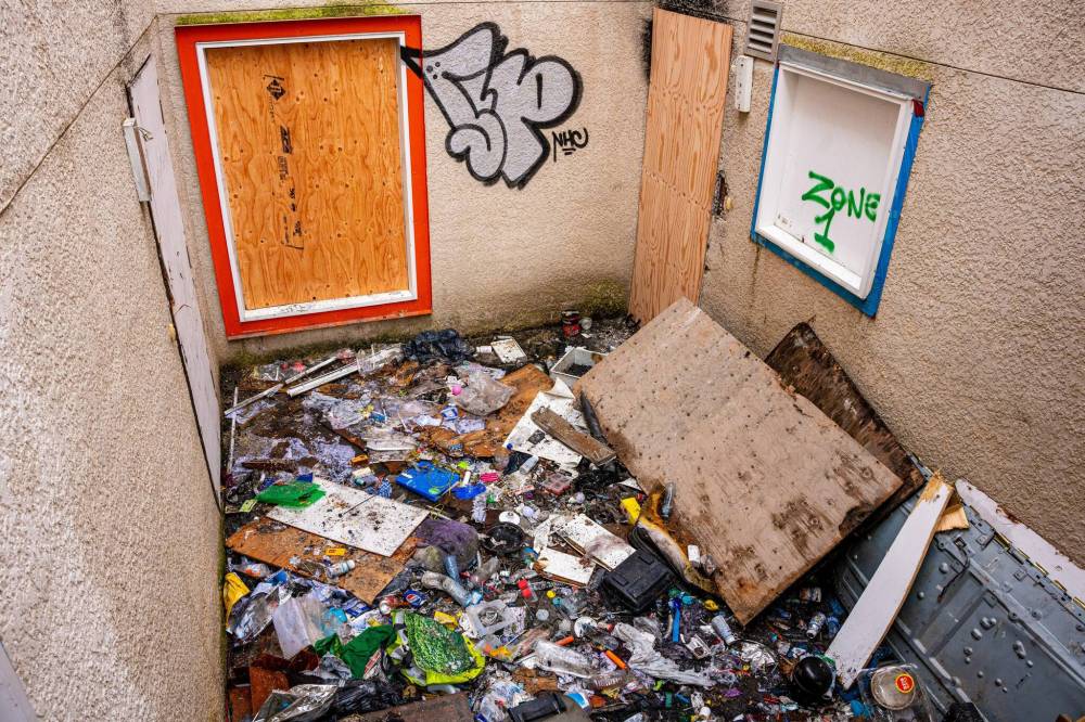 NIC ADAM / FREE PRESS
Garbage, among it used needles, litters the ground near the burned apartment at Centre Village.