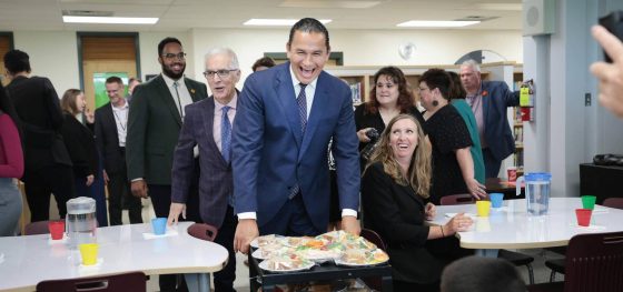 Manitoba Premier Wab Kinew and Education Minister Nello Altomare hand out free lunches to students on Thursday at Donwood School in Winnipeg to launch the province’s school nutrition program. (Ruth Bonneville / Winnipeg Free Press)