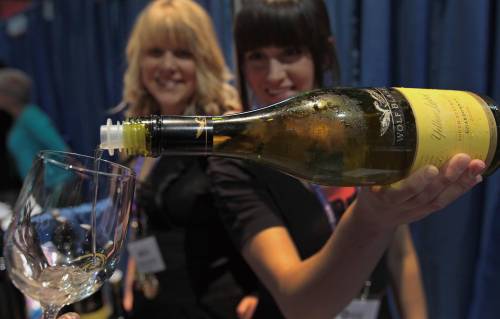 JOE.BRYKSA@FREEPRESS.MB.CA Local-(See standup photo)- Kriata Lemoine, left, and Gabrielle Douchant pour some Wolf Blass Chardonnay at the 9th annual Winnipeg Wine Festival featuring 32 Austrialian Wine makers- The Festival runs at the Winnipeg Convention Center until May 01, 2010 - Proceeds from the event at for Special oympics Manitoba- JOE BRYKSA/WINNIPEG FREE PRESS- Apr 30, 2010