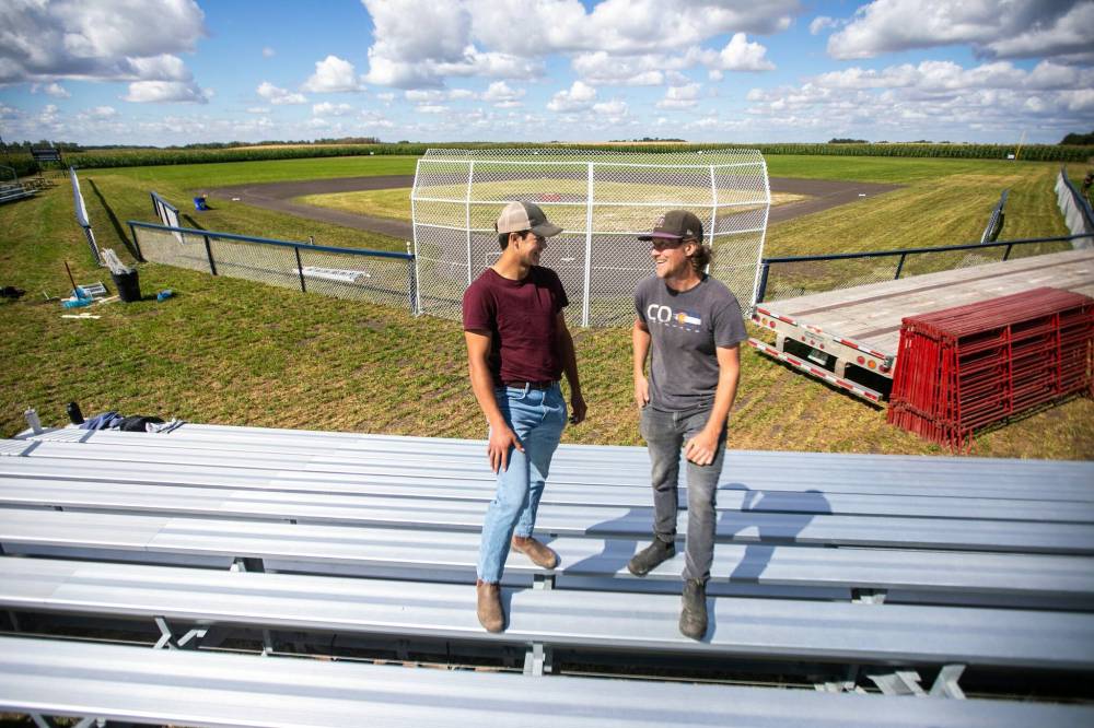 MIKAELA MACKENZIE / FREE PRESS
Joe Gardiner
(right, with
Guilford) had been
thinking about
transforming a
corn field into a
ball field for years.