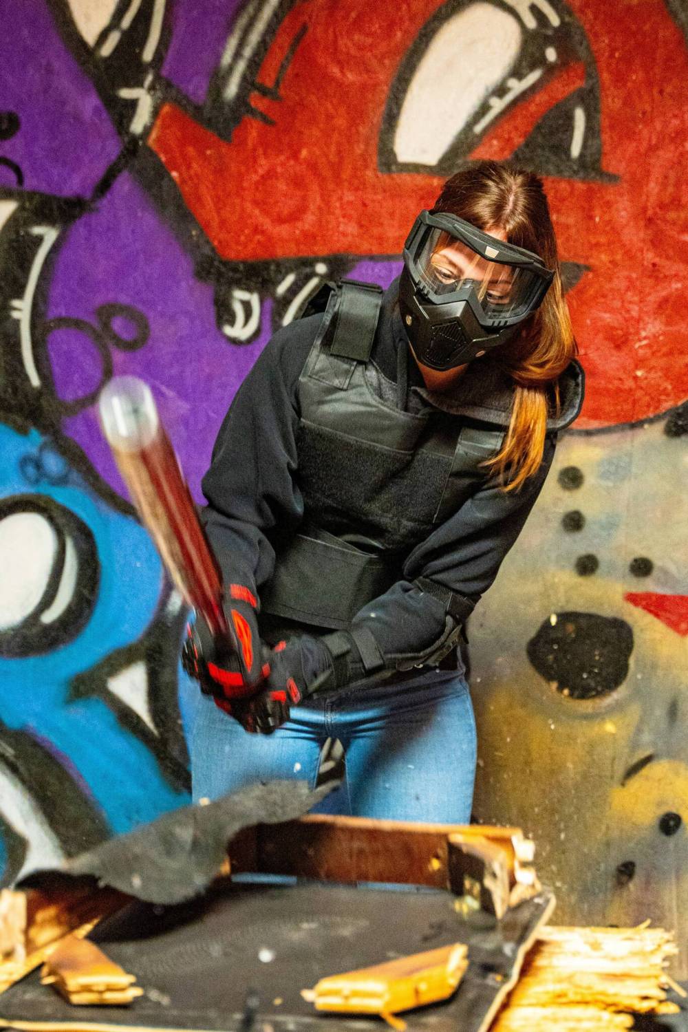 NIC ADAM / FREE PRESS
Kailey Faith, one of Unleashed Rage Rooms’ first two official customers, breaks everything from beer bottles to printers in Unleashed’s Jason (the shining) room.