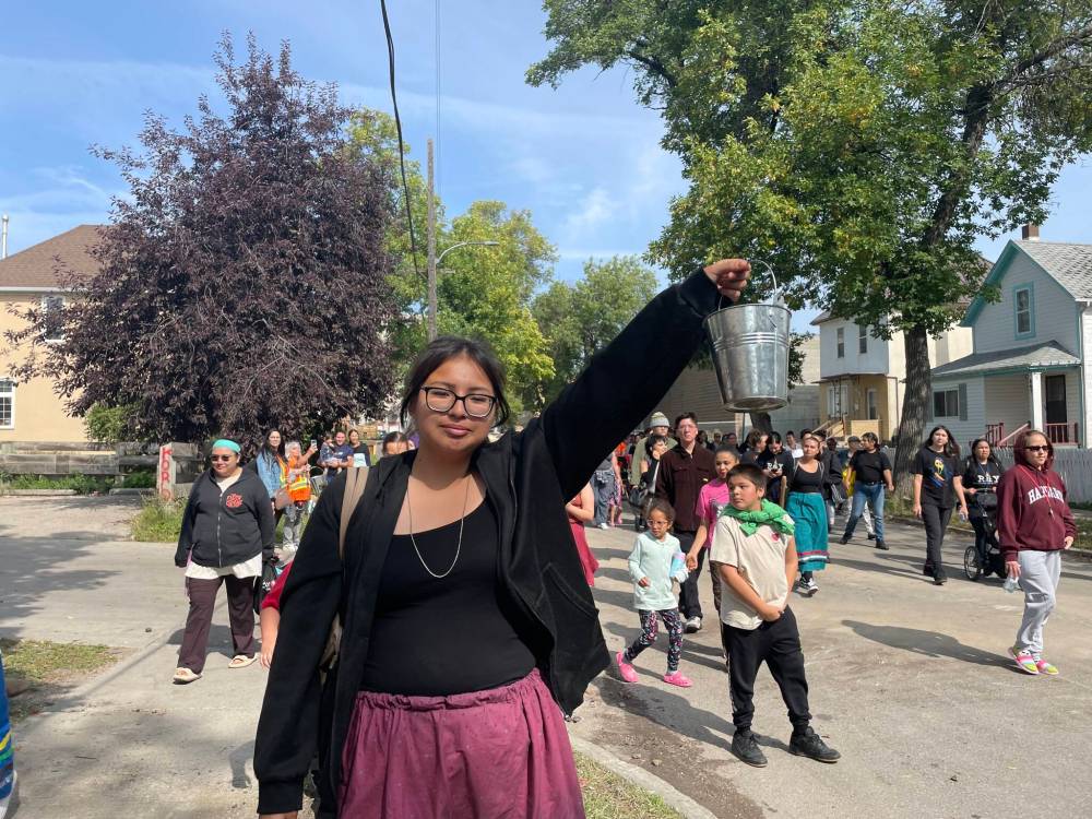 Maggie Macintosh / Free Press
Marisska Paul, 19, said it was an honour to hold a smudging bucket during the inaugural West End “Smudge our Streets” event on Saturday.