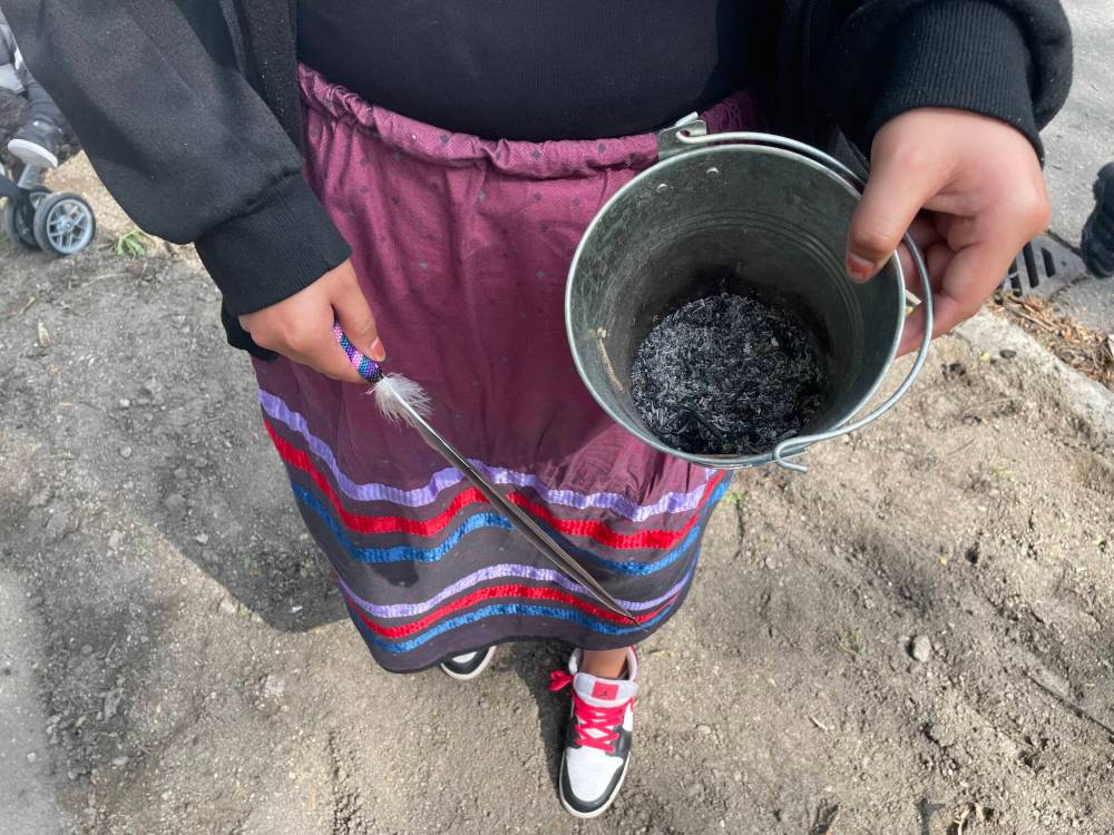 Maggie Macintosh / Free Press
Marisska Paul, 19, said it was an honour to hold a smudging bucket during the inaugural West End