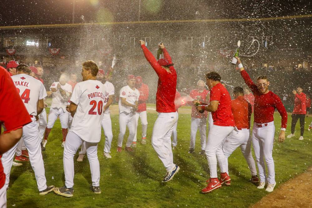 DAVE MAHUSSIER PHOTO
                                Winnipeg Goldeyes celebrate victory over Sioux Falls Canaries in Game 3 of Playoff Series.