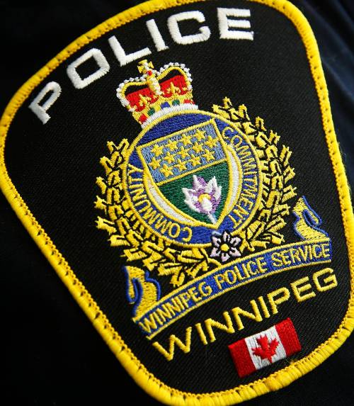Photo of a Winnipeg Police Service shoulder badge on an officer in Winnipeg Tuesday, November 5, 2019. THE CANADIAN PRESS/John Woods