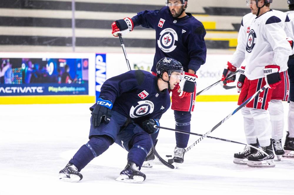 MIKAELA MACKENZIE / FREE PRESS
Two dozen members of the Winnipeg Jets, including Neal Pionk (4), took part in Tuesday’s captain’s skate.