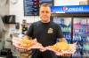 BROOK JONES / FREE PRESS
                                Winnipegger Eric Saniuk, 30, owner of Blazing Chicken Shack, serves a Queen City Buffalo Sando and a Music City Nashville Sando at his restuarant at 392 Graham Ave., in Winnipeg, Man., Monday, Sept. 16, 2024. Saniuk hosted a grand opening Friday, Sept. 13, 2024.