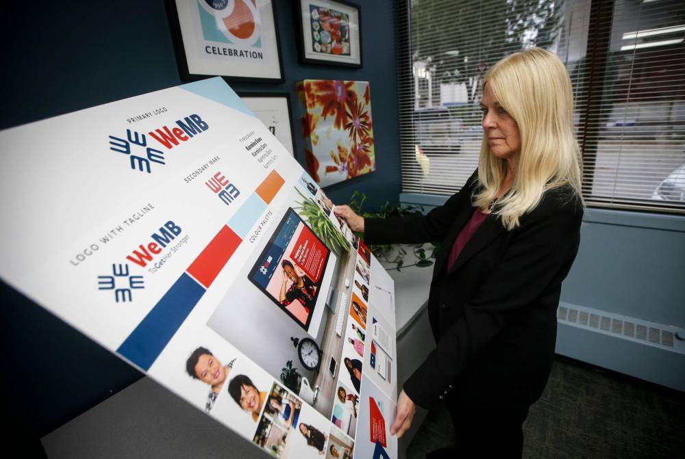 JOHN WOODS / FREE PRESS
Max Kashton, CEO of the newly named WeMB, looks over a branding idea board in her Winnipeg office Monday.