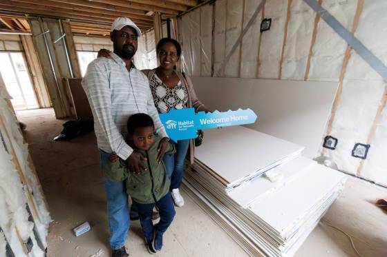 Workeabeba Asfaw and Addis Aboye with their son, Eyoab, 5, inside their almost completed home. ‘Having a home means everything,’ says Asfaw. (Mike Deal / Free Press)