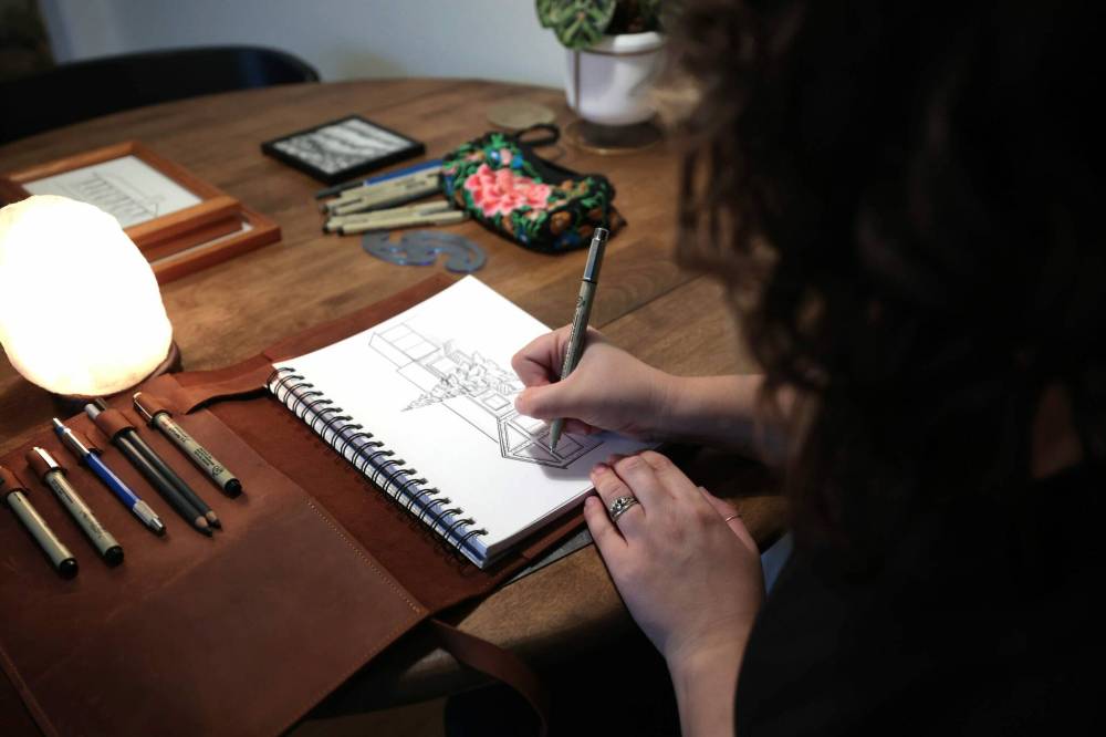 Ruth Bonneville / Free Press
Artist, Kris Kuzdub, working at home on her signature work.