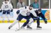 Nino Niederreiter, 32, fights off a check in practice. (Mike Deal / Free Press)