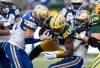 JASON FRANSON / THE CANADIAN PRESS
                                Blue Bombers defensive back Evan Holm (31) and safety Brandon Alexander (37) tackle Edmonton’s Kevin Brown (centre) during first-half action.