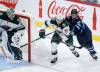 JOHN WOODS / THE CANADIAN PRESS
                                Winnipeg’s Nikita Chibrikov (90) and Minnesota’s Carson Lambos (71) chase a loose puck during the second period Saturday.