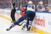 JASON FRANSON / THE CANADIAN PRESS
                                Winnipeg’s Jaret Anderson-Dolan is checked by Edmonton’s Joshua Brown.