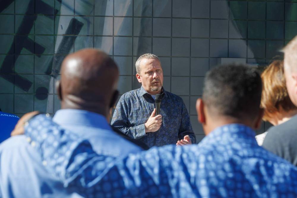 MIKE DEAL / FREE PRESS
Chris Scott, ATU President, speaks at a rally beside the Union Centre at 275 Broadway, Tuesday, to demand equal rights, permanent resident status for all migrants.