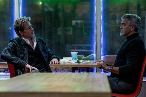 Brad Pitt, left, and George Clooney in &ldquo;Wolfs.&rdquo; (Apple TV+/TNS)